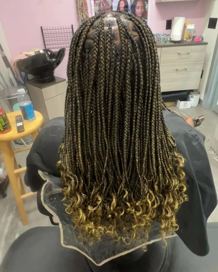 Knotless braids with golden ends
